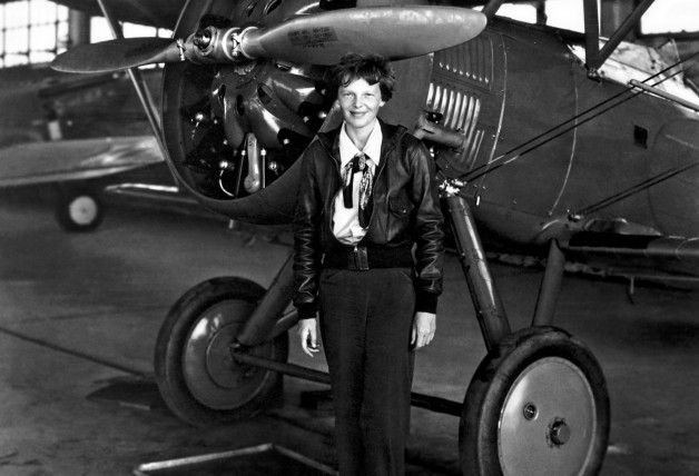 July 30, 1936 - Burbank, CA, United States of America - Aviation pioneer Amelia Earhart poses with her airplane in a hangar July 30, 1936. Earhart was the first female aviator to fly solo across the Atlantic Ocean