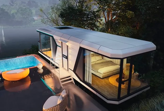 casa modular vessel junto a un lago