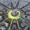 Activistas pintan un sol en el arco de Triunfo de Paris para demandar a las políticos el uso de energías renovables.