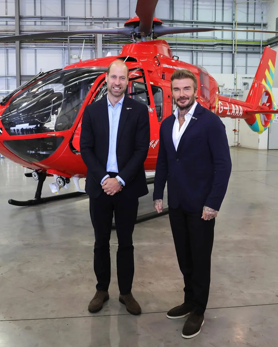 David Beckham y el príncipe Guillermo en la sede de la organización.